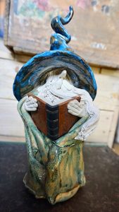 Large signed ceramic wizard with book