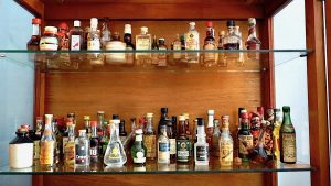 Lot of 100 Vintage mini glass liquor bottles